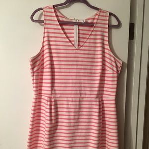 Pink and white striped dress with defined waist.
